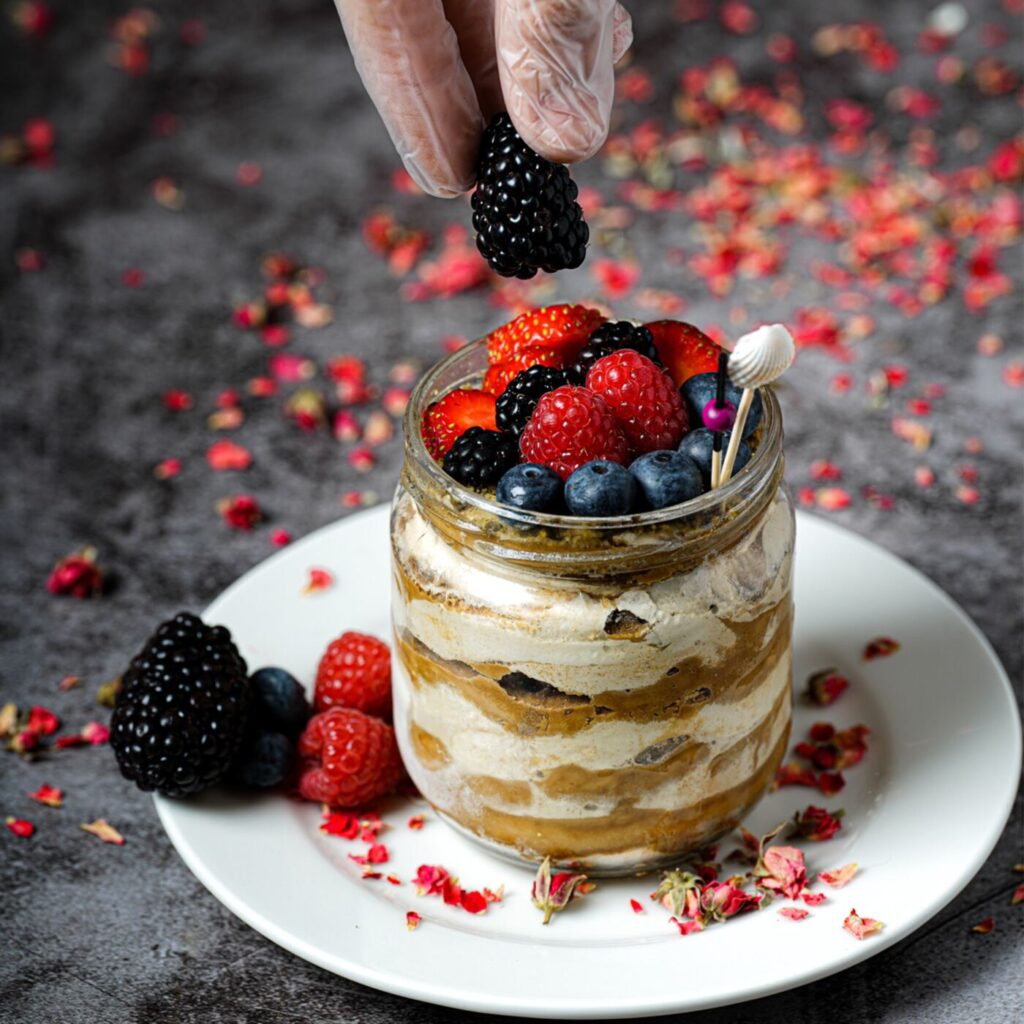 Individual tiramisu topped with berries