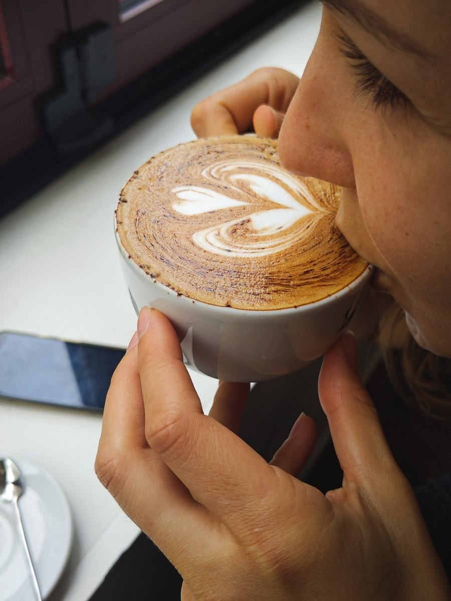 Nicole enjoying a latte